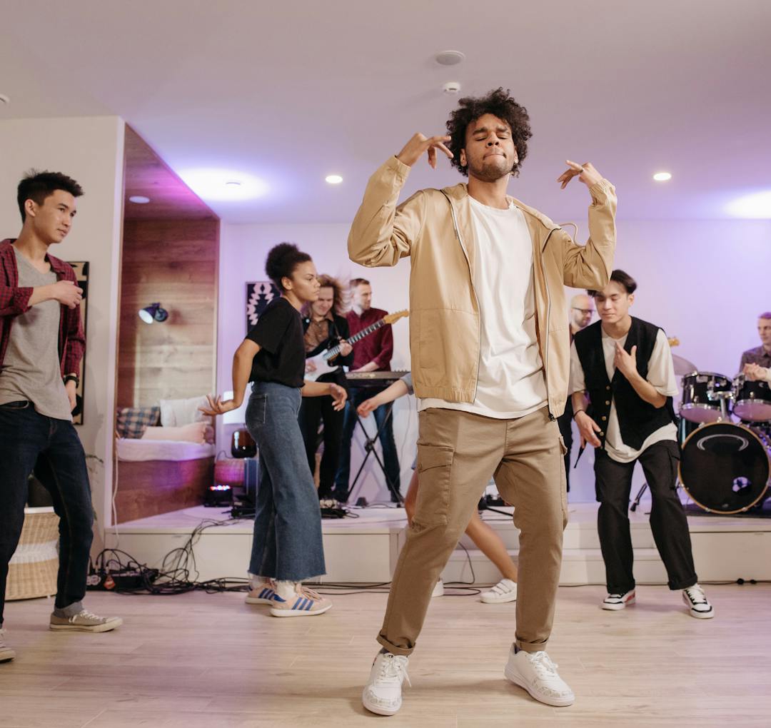 Friends dancing during an indoor music party.